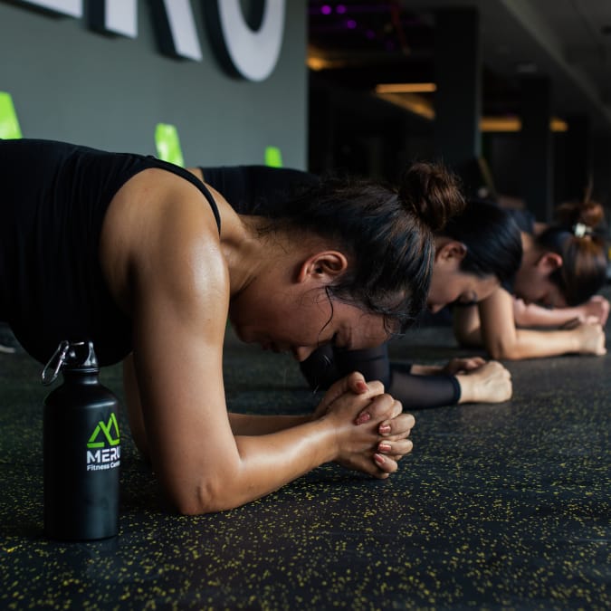 Group of ladies doing plank at Meru Fitness